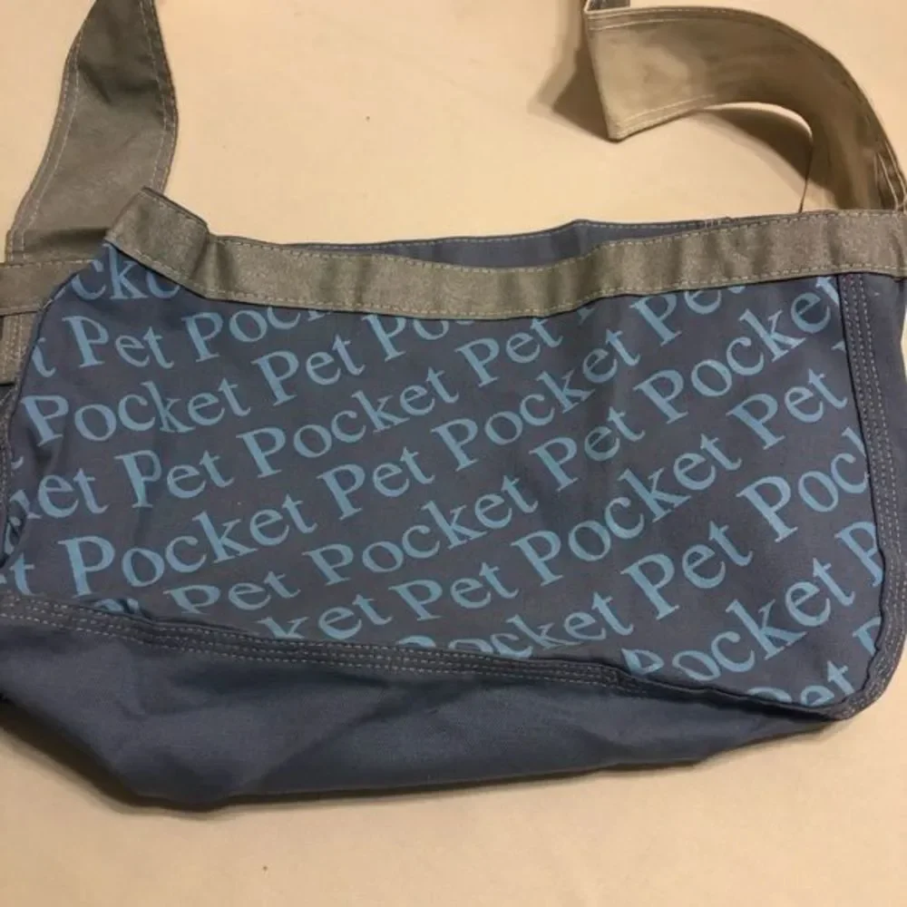 Pet carrier-NWOT. NEVER USED. Picture with the person and dog for example only.